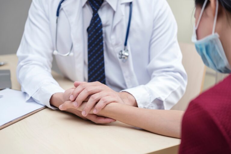 Healthy and medical concept. Doctor holding patient hand to give encourage in hospital.